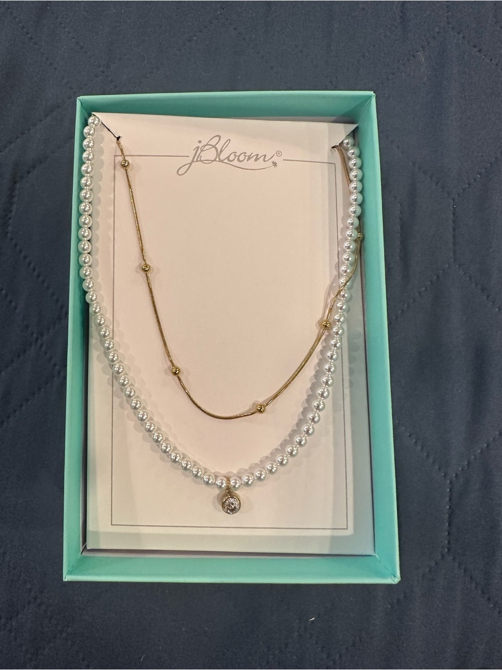NWT bloom layered White Pearl W/crystal accent and Gold Beaded Chain.